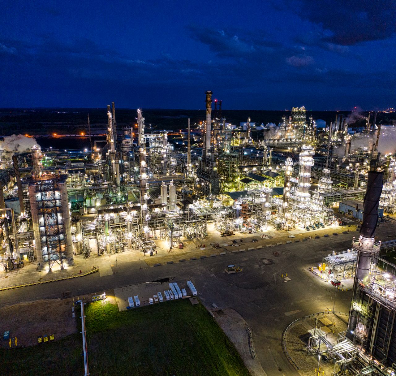 The Art of Drawing Readers In: Your attractive post title goes here Dramatic aerial shot of an illuminated oil refinery at night in Rosemount, MN.