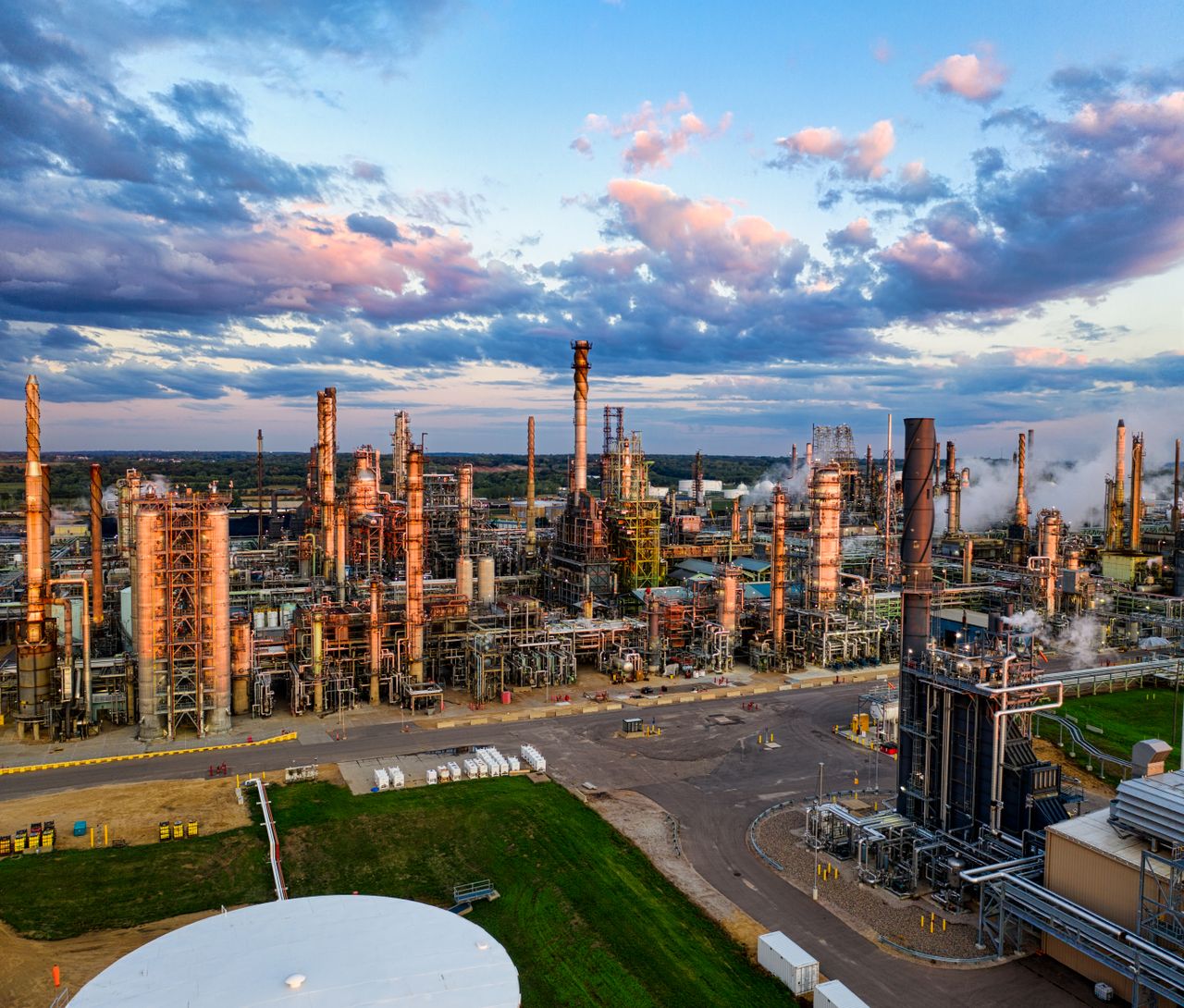 Services Stunning aerial shot of an oil refinery in Rosemount, MN, showcasing industrial complexity at sunset.