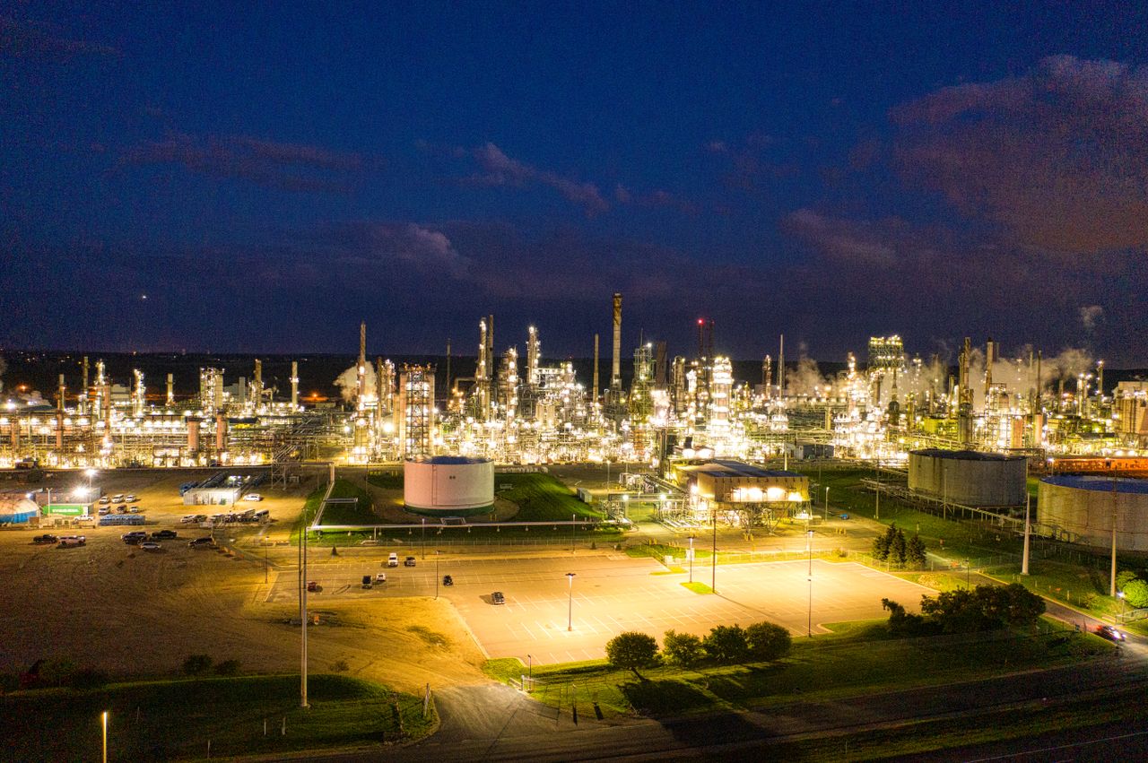 Services A stunning aerial shot of an illuminated oil refinery at night showcasing industrial production in Rosemount, MN.