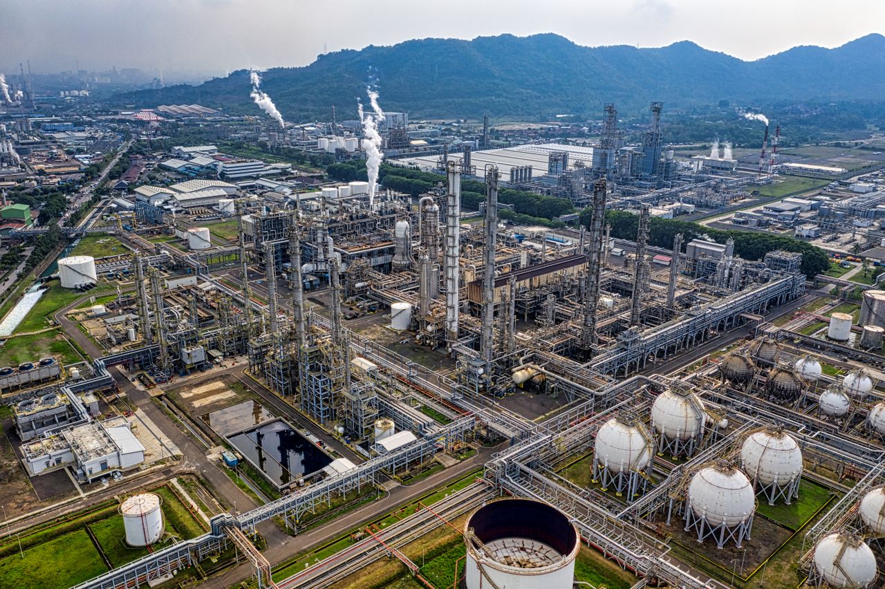 Home Aerial view of a large industrial oil refinery in Banten, Indonesia with storage tanks and pipelines.